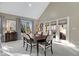 Dining room with vaulted ceiling, large window, and access to a patio at 1621 Rosebud Ln, Greenwood, IN 46143