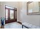 Inviting foyer with decorative glass front door, high ceilings, and a bench at 1621 Rosebud Ln, Greenwood, IN 46143