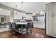Modern kitchen with white cabinets, granite counters, and a central island at 1621 Rosebud Ln, Greenwood, IN 46143