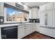 Updated kitchen featuring white cabinets, stainless steel appliances, and sleek countertops at 1621 Rosebud Ln, Greenwood, IN 46143