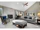 Bright living room with vaulted ceiling, fireplace, and neutral décor at 1621 Rosebud Ln, Greenwood, IN 46143