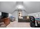 Attic living room space with desk, chair, couch and television at 1621 Rosebud Ln, Greenwood, IN 46143