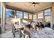 Screened in patio with stylish outdoor furniture and a ceiling fan at 1621 Rosebud Ln, Greenwood, IN 46143