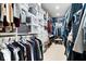 Spacious walk-in closet with custom shelving, hanging rods, and ample storage for clothes and accessories at 1621 Rosebud Ln, Greenwood, IN 46143