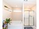 Bathroom features a soaking tub next to a window and a glass enclosed shower stall at 16406 Taconite Dr, Noblesville, IN 46060