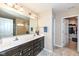 Bathroom features a double sink vanity with a large mirror, and a doorway to a closet and toilet at 16406 Taconite Dr, Noblesville, IN 46060