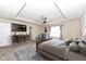 Primary bedroom with tray ceiling, ceiling fan, and sitting area at 16406 Taconite Dr, Noblesville, IN 46060