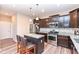 Modern kitchen features stainless steel appliances, granite countertops, and a breakfast bar with seating at 16406 Taconite Dr, Noblesville, IN 46060