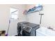 Functional laundry room includes modern washer and dryer set, storage shelf, and utility sink at 16406 Taconite Dr, Noblesville, IN 46060