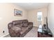 Living room featuring a plush couch, TV on stand, neutral walls, and carpet floors at 16406 Taconite Dr, Noblesville, IN 46060