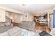 Spacious living room with hardwood floors, a fireplace, and an open layout to the kitchen and dining area at 16406 Taconite Dr, Noblesville, IN 46060