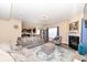 Open-concept living room with hardwood floors, a fireplace, and seamless access to the kitchen at 16406 Taconite Dr, Noblesville, IN 46060