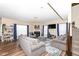 Comfortable living room with a fireplace, large windows, and stylish furniture at 16406 Taconite Dr, Noblesville, IN 46060