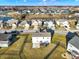 Aerial perspective of the property showcasing the backyard, deck, and surrounding neighborhood at 16736 Workington Way, Westfield, IN 46074