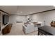 Spacious carpeted basement featuring a large seating area and an adjacent office area at 16736 Workington Way, Westfield, IN 46074