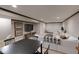 Carpeted basement boasts a sectional sofa, entertainment area and a dedicated workspace at 16736 Workington Way, Westfield, IN 46074