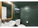 Stylish powder room featuring painted walls, a decorative mirror, and modern fixtures at 16736 Workington Way, Westfield, IN 46074