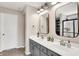 Double vanity bathroom featuring modern fixtures, granite counters, and ample cabinet space at 16736 Workington Way, Westfield, IN 46074