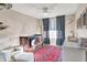 Cozy Bedroom with a comfortable chair and ottoman, perfect for relaxation with a stylish red rug at 16736 Workington Way, Westfield, IN 46074