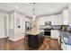 Modern kitchen with granite countertops, a center island with seating, and stainless steel appliances at 16736 Workington Way, Westfield, IN 46074