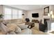 Bright living room featuring a fireplace, comfortable seating, and stylish decor at 16736 Workington Way, Westfield, IN 46074
