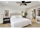 Beautiful main bedroom boasts a ceiling fan, ensuite bath, and a soothing color palette at 16736 Workington Way, Westfield, IN 46074