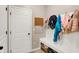 Welcoming mudroom featuring a coat rack, and storage, seamlessly blending functionality with style at 16736 Workington Way, Westfield, IN 46074