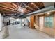 Spacious unfinished basement with laundry, water conditioning, and a separate finished area at 1711 Kessler E Blvd, Indianapolis, IN 46220