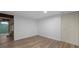 Renovated bedroom with new wood floors, fresh paint, and closet for ample storage space at 1711 Kessler E Blvd, Indianapolis, IN 46220