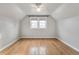 Bright and airy bedroom featuring hardwood floors and large windows that provide lots of natural light at 1711 Kessler E Blvd, Indianapolis, IN 46220