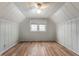 Bright and airy bedroom featuring paneled walls, hardwood floors and large windows that provide lots of light at 1711 Kessler E Blvd, Indianapolis, IN 46220