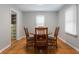 Dining room featuring wood floors, a round table and a view into the kitchen at 1711 Kessler E Blvd, Indianapolis, IN 46220