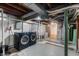 Basement with laundry area with modern washer and dryer machines and utilities at 1711 Kessler E Blvd, Indianapolis, IN 46220