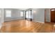 Hardwood floors throughout the living room with natural lighting and neutral paint at 1711 Kessler E Blvd, Indianapolis, IN 46220