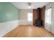 Wood floors throughout with a brick fireplace and large windows offering lots of light at 1711 Kessler E Blvd, Indianapolis, IN 46220