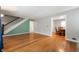 Open living room with hardwood floors with view to the dining room at 1711 Kessler E Blvd, Indianapolis, IN 46220