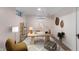 Comfortable home office with a large desk, shelves, and cozy seating area at 1711 Kessler E Blvd, Indianapolis, IN 46220