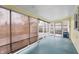 Charming sunroom with retractable shades offering a relaxing space for outdoor enjoyment at 1711 Kessler E Blvd, Indianapolis, IN 46220
