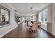 Bright dining room boasts a modern chandelier, large windows, and neutral decor for versatile style at 181 Cline St, Westfield, IN 46074