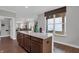 Kitchen island boasts a light countertop and views into an adjacent living space at 181 Cline St, Westfield, IN 46074