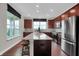 Well-lit kitchen featuring an island with stool seating and modern appliances at 181 Cline St, Westfield, IN 46074