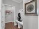 The mudroom features open shelving, a bench, and art at 181 Cline St, Westfield, IN 46074