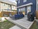 A relaxing back deck with an outdoor sofa, patio furniture and gas grill is the perfect entertaining space at 1838 Alabama St, Indianapolis, IN 46202