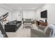Spacious basement area with comfortable seating, television, and exercise equipment at 1838 Alabama St, Indianapolis, IN 46202