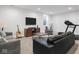Comfortable basement area with sofas, guitar, television, and exercise equipment at 1838 Alabama St, Indianapolis, IN 46202
