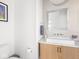 Modern powder room with a geometric-tiled wall, a unique vessel sink, and stylish fixtures at 1838 Alabama St, Indianapolis, IN 46202
