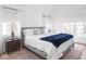 Sun-filled bedroom with bright white walls, modern furnishings, and a large bed with plush bedding at 1838 Alabama St, Indianapolis, IN 46202