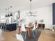 A dining room seamlessly connects to a modern kitchen featuring wooden floors at 1838 Alabama St, Indianapolis, IN 46202