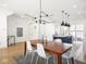 Open floorplan shows dining room, kitchen, and living room with hardwood floors at 1838 Alabama St, Indianapolis, IN 46202