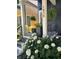 Charming front porch adorned with lush hydrangeas and hanging ferns at 1838 Alabama St, Indianapolis, IN 46202